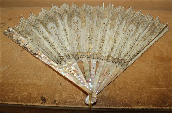 Late 18th century French pierced ivory and painted fan & a gold sequinned fan (2)(-)